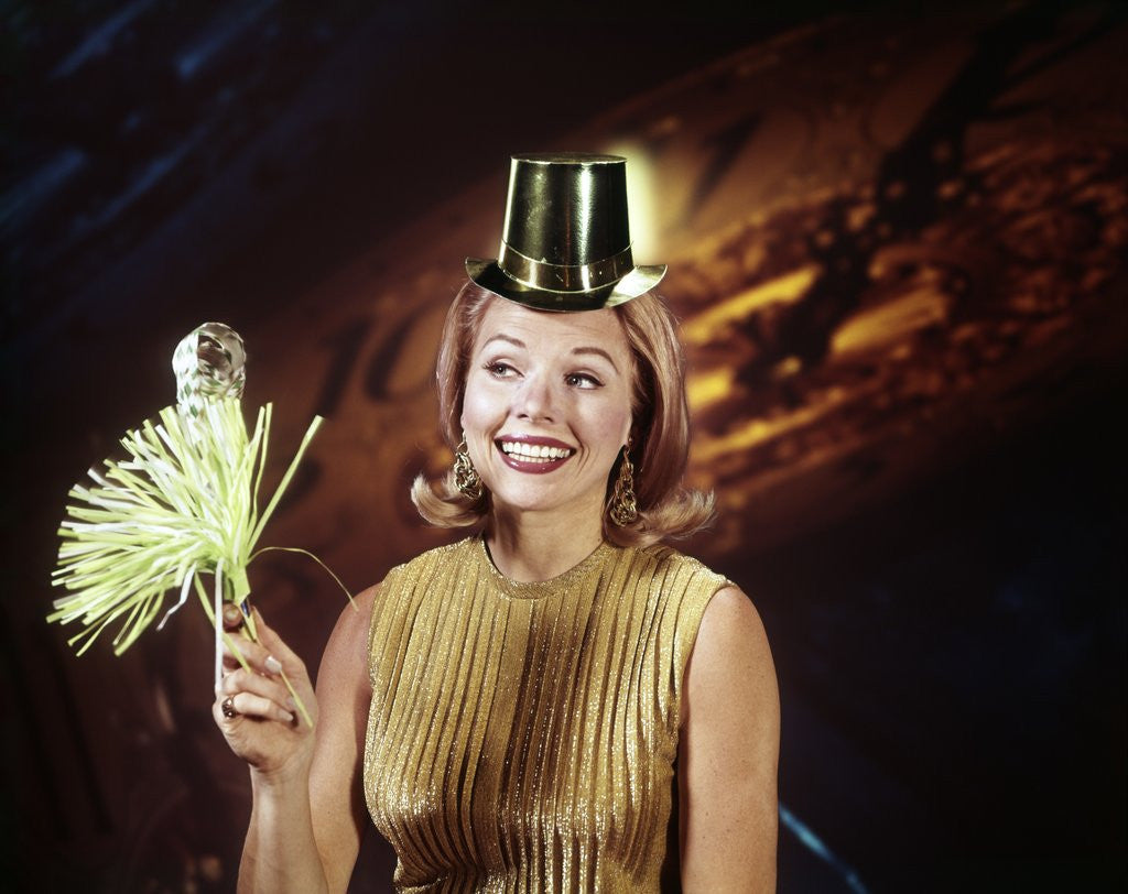 Detail of 1960s Young Blonde Woman Party Hat Noisemaker Horn Smiling New Year Clock Background by Anonymous