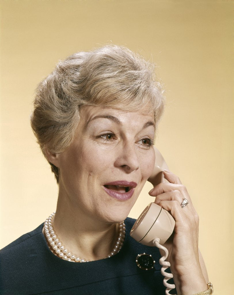 Detail of 1960s Smiling Happy Senior Woman Talking On Telephone by Anonymous