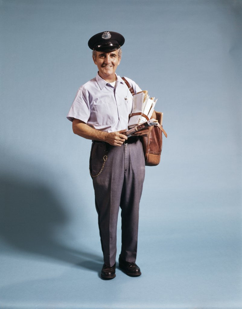 Detail of 1970s Standing Full Length Portrait Of Middle Aged Mailman Carrying Mail Bag Wearing Uniform by Corbis