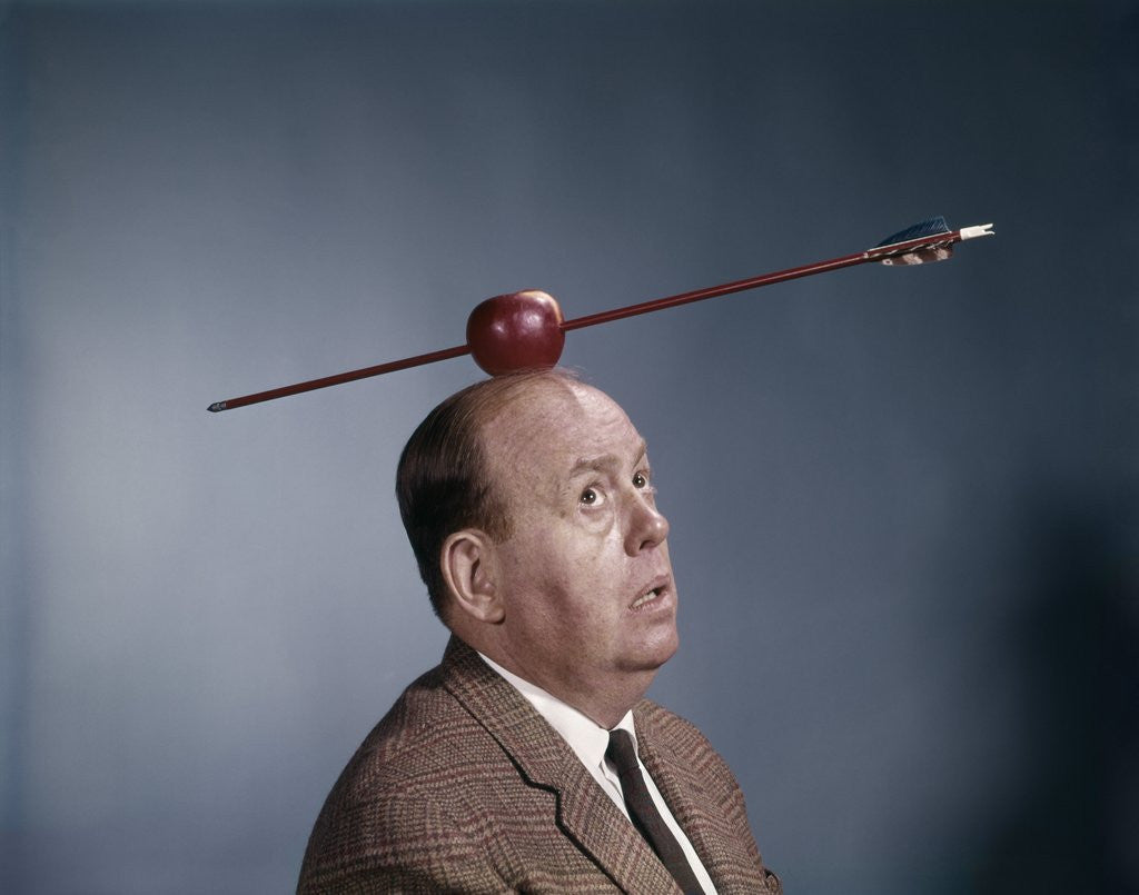 Detail of 1960s Anxious Nervous Man Looking Up At Arrow Shot Through An Apple Sitting On Top Of His Head by Anonymous