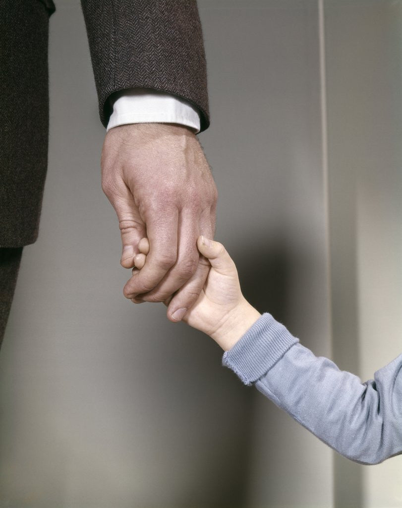 Detail of 1960s Adult Man Hand Holding That Of Small Child Toddler Father Young Old Safety Protection Guidance Retro by Anonymous