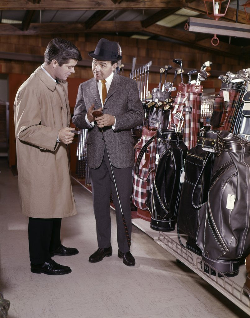 Detail of 1960s Two Men In Golf Equipment Shop Talking And Discussing Purchase Of A Driver Golf Club by Anonymous