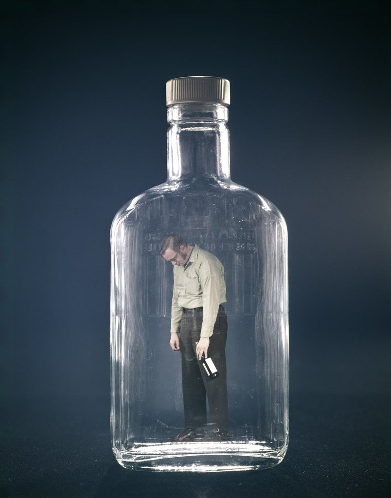 Detail of 1960s Slumped Over Alcoholic Man Holding Whiskey Bottle Trapped Inside Glass Alcohol Decanter Bottle by Anonymous