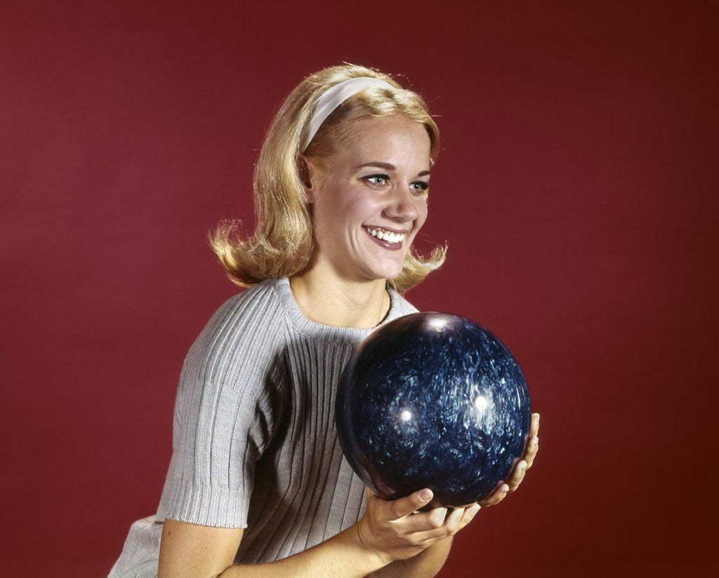 Detail of 1960s Young Blonde Woman Holding Bowling Ball Wearing Blue Sweater by Anonymous