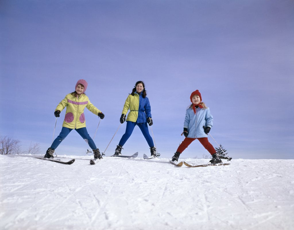 Detail of mother And Two Daughters Skiing Together Winter Outdoor by Corbis