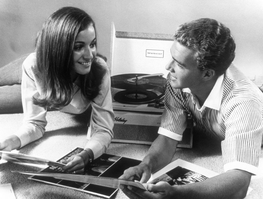 Detail of 1960s Teen Couple Playing Lp Vinyl Records On Portable Phonograph by Anonymous