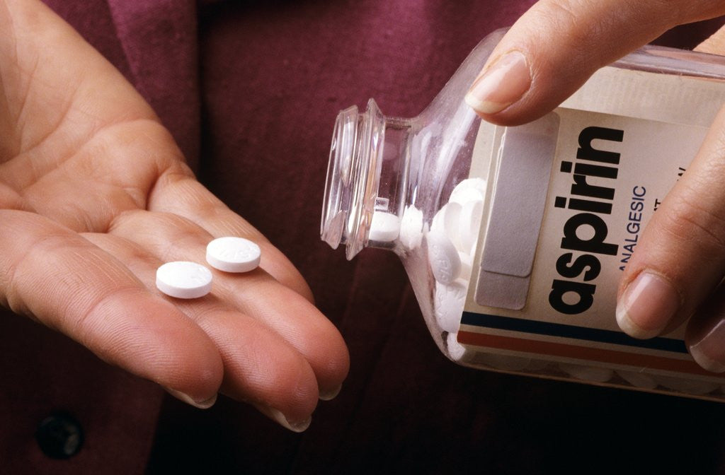 Detail of 1990s Female Hand Taking Two Aspirin Tablets From Bottle by Anonymous