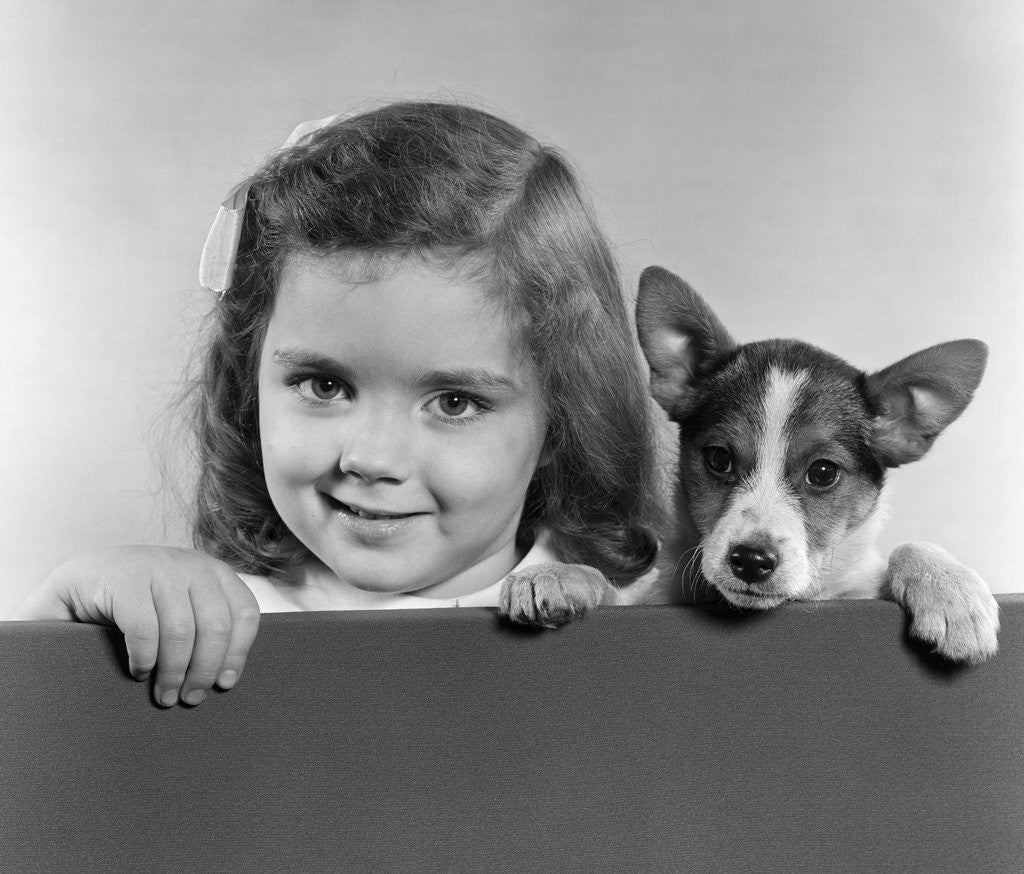Detail of 1940s 1950s Portrait Of Little Girl With Small Dog Looking At Camera by Corbis
