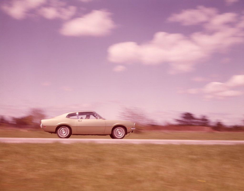 Detail of 1960s Blurred Motion Of Car On Road by Corbis