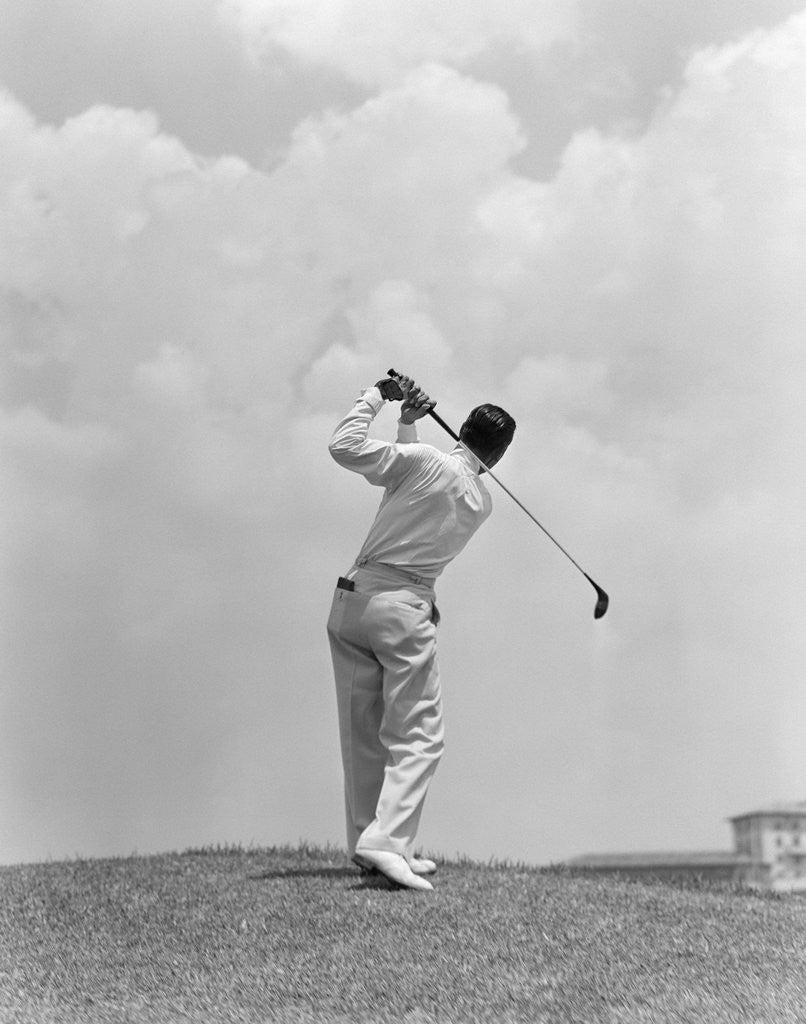 Detail of 1930s Man Playing Golf Teeing-off Golf Ball From Tee With Driver Outdoor by Anonymous