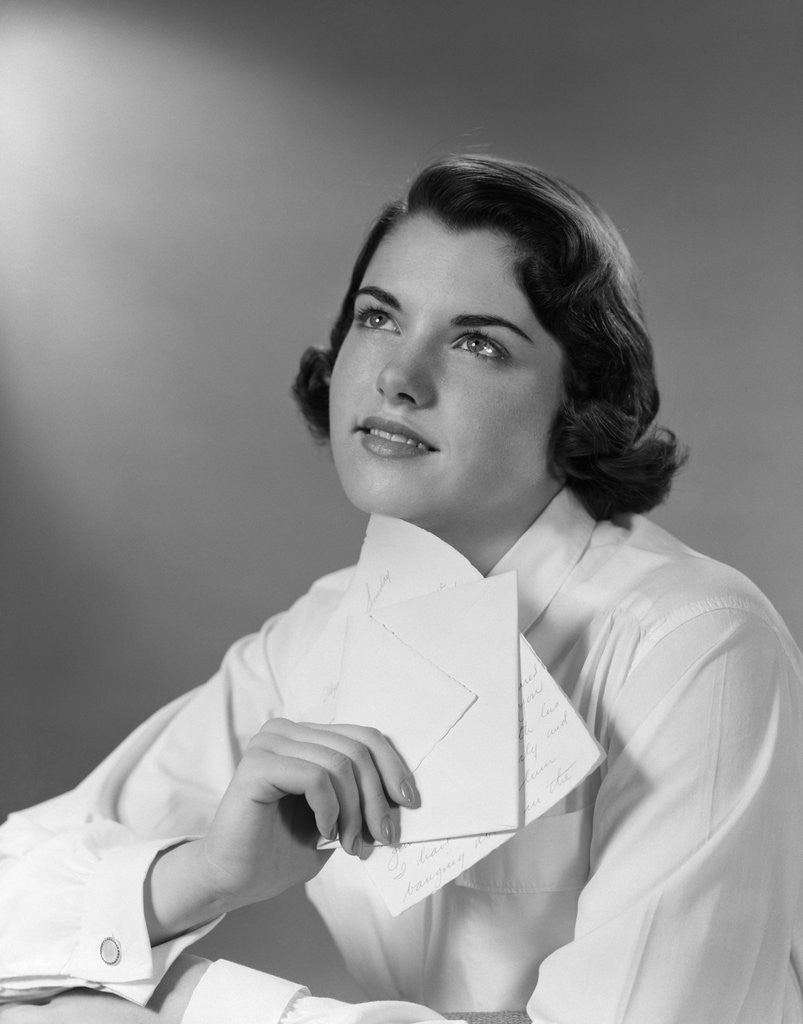 Detail of 1950s Teenage Girl Reading A Letter And Dreaming A Daydream by Anonymous