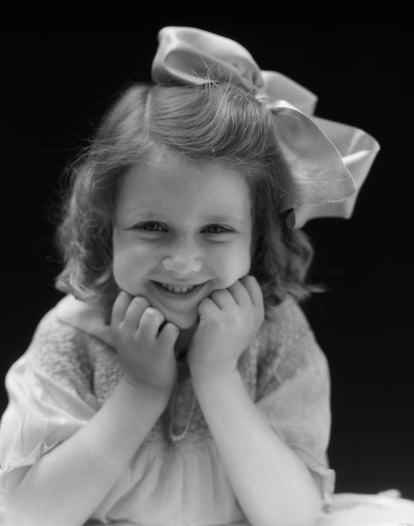 Detail of 1930s Portrait Smiling Brunette Girl With Big Ribbon Bow In Her Hair Looking At Camera by Corbis