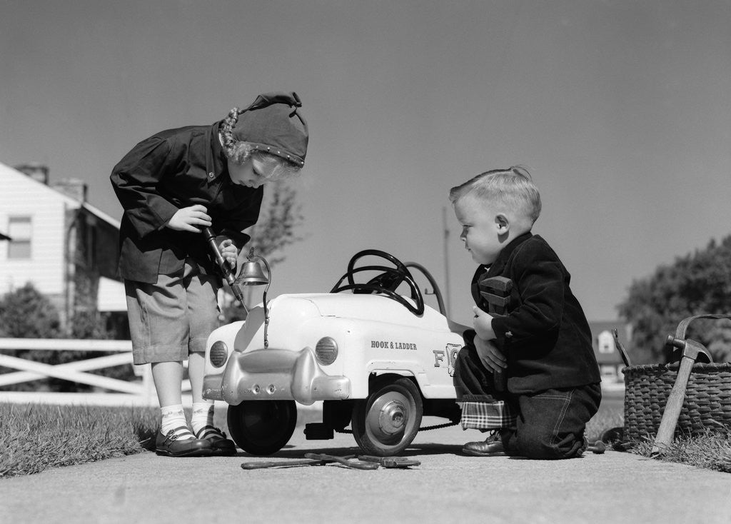 Detail of 1950s Boy And Girl Playing At Repairing Toy Car by Anonymous