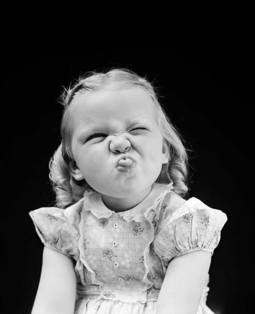 Detail of 1940s Portrait Of Girl Sticking Out Tongue Wrinkled Up Nose by Anonymous