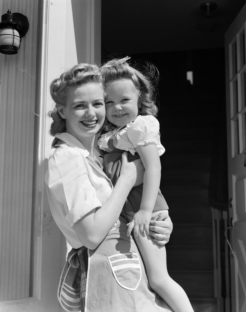 Detail of 1940s Portrait Woman Mother Holding Girl Daughter Smiling Looking At Camera by Anonymous