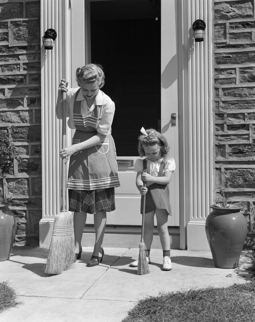 Detail of 1940s Mother And Daughter Sweeping Sidewalk In Front Of Home by Anonymous