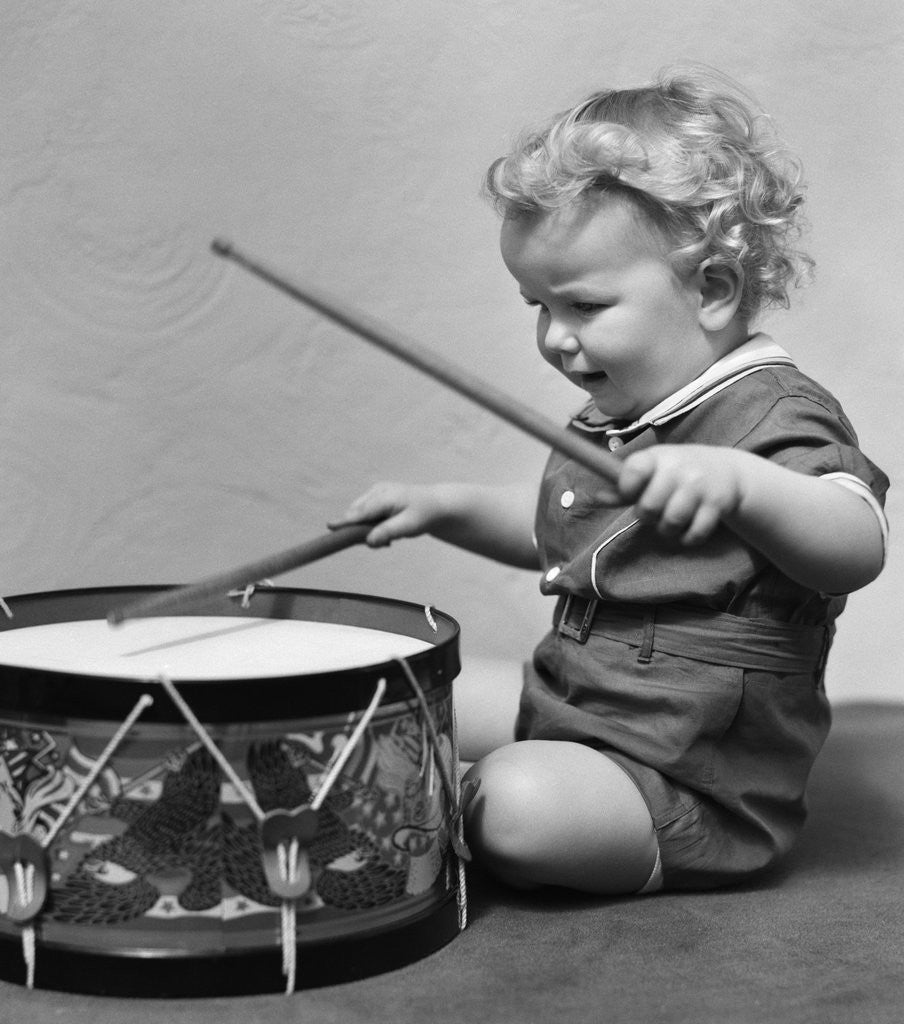 Detail of 1930s Toddler Boy Playing Toy Drum by Anonymous
