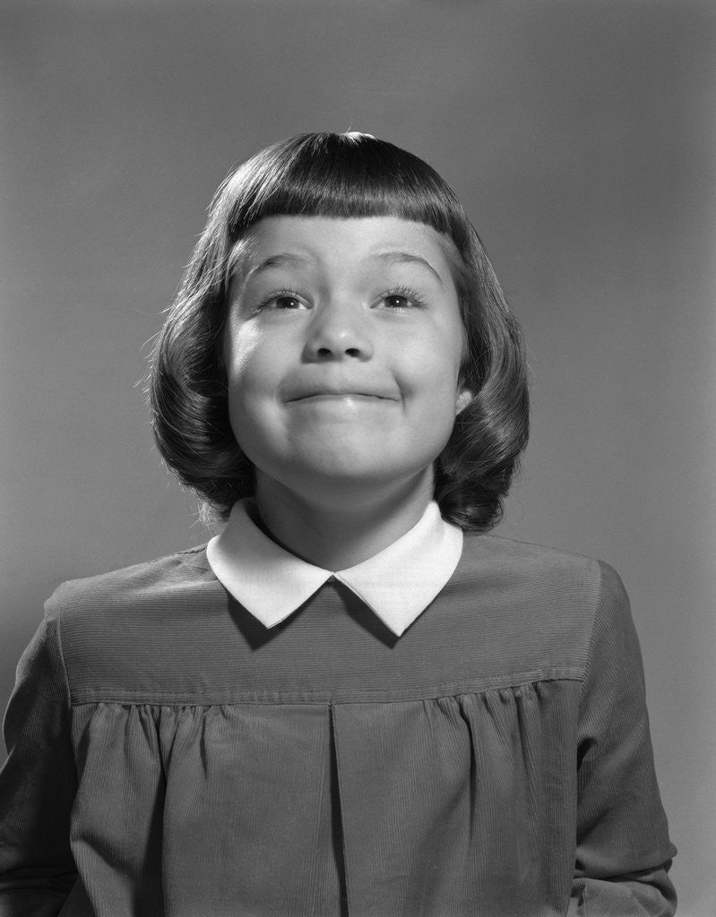 Detail of 1950s Girl Page Boy Hair Bangs Smiling Funny Facial Expression Looking At Camera by Anonymous