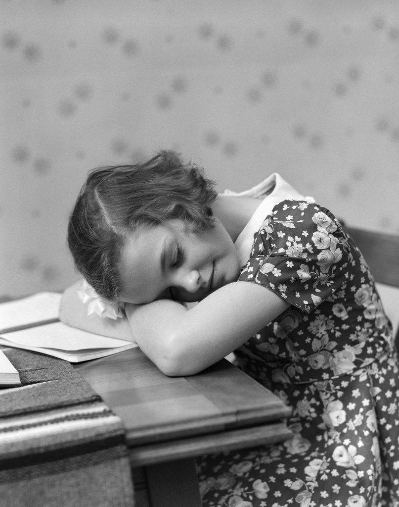 Detail of 1930s Teenage Girl Sleeping Head Resting On Table Desk While Studying by Corbis