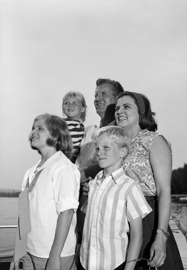 Detail of 1960s Smiling Family Portrait Father Mother Two Daughters Son Standing Together Outdoors by Corbis