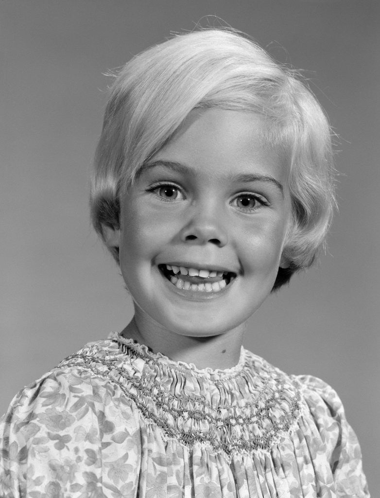 Detail of 1960s Portrait Of Smiling Blond Girl Looking At Camera by Anonymous