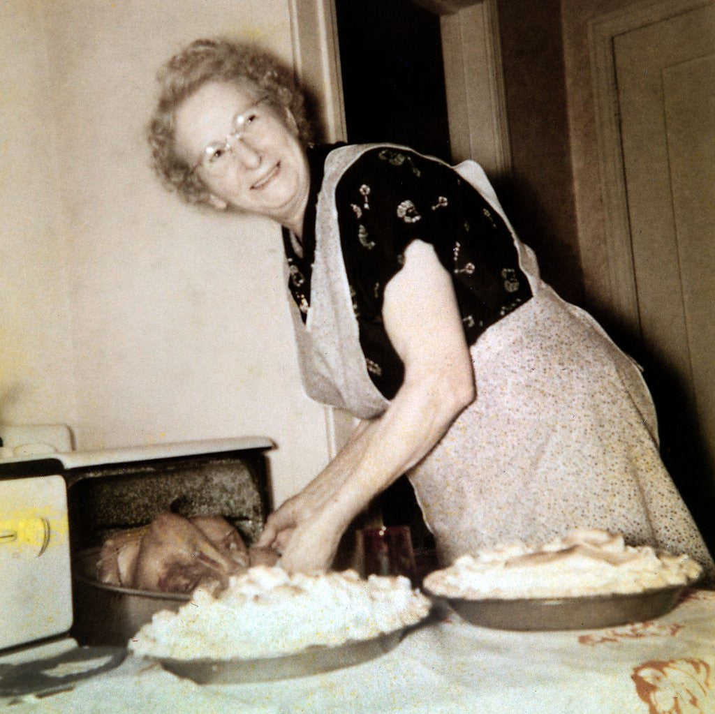 Detail of Grandma cooks in the kitchen, ca. 1952 by Corbis
