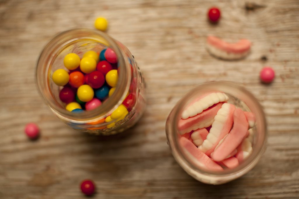 Detail of Bubble gum balls and teeth candy in mason jars by Anonymous
