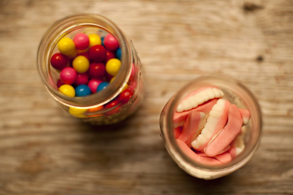 Detail of Bubble gum balls and teeth candy in mason jars by Anonymous