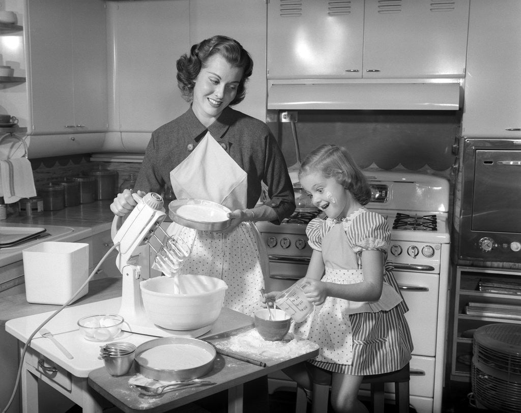 Detail of 1950s mother and daughter baking a cake by Anonymous