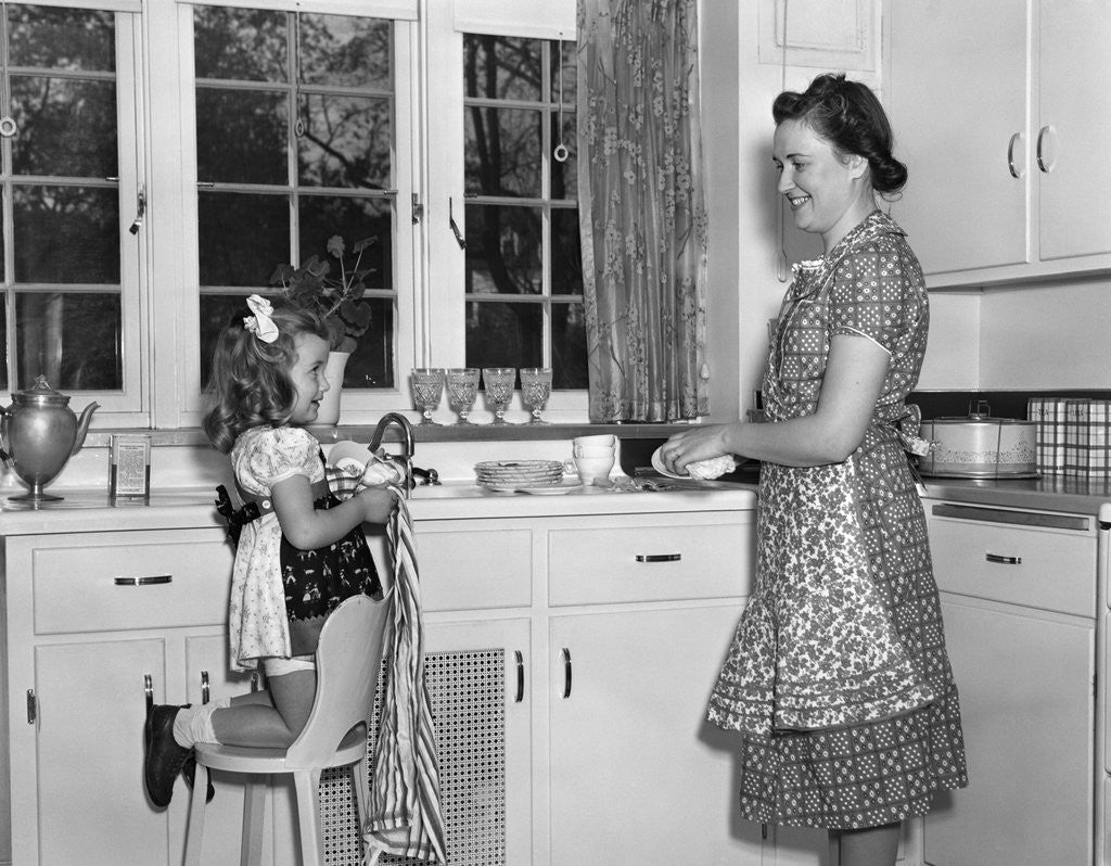 Detail of 1930s 1940s mother and daughter washing dishes by Anonymous