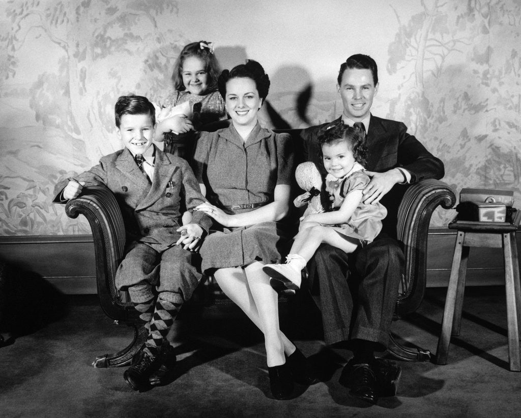 Detail of 1930s 1940s family of five on a couch by Anonymous