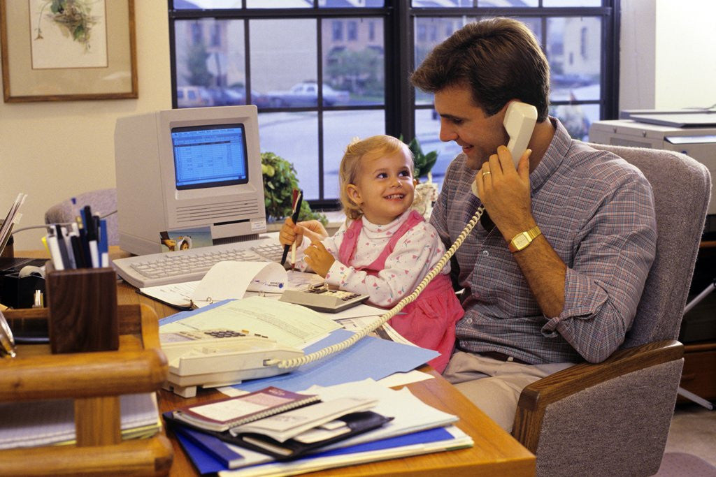 Detail of Father with young daughter in home office by Anonymous
