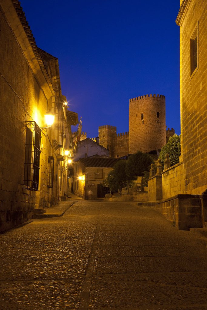 Detail of Streets of Banos de la Encina at night with the Moorish castle, named Burgalimar Castle, in the back by Anonymous