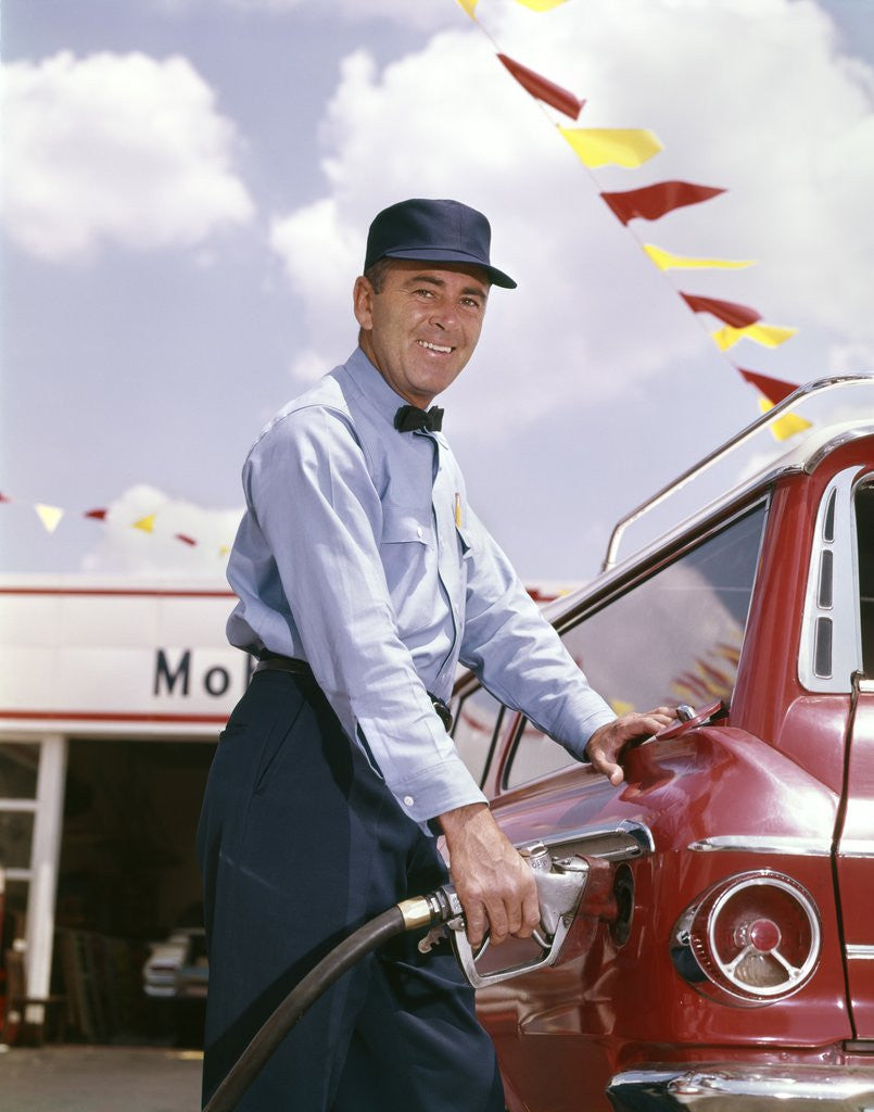 Detail of 1950s smiling service station attendant pumping gas by Anonymous