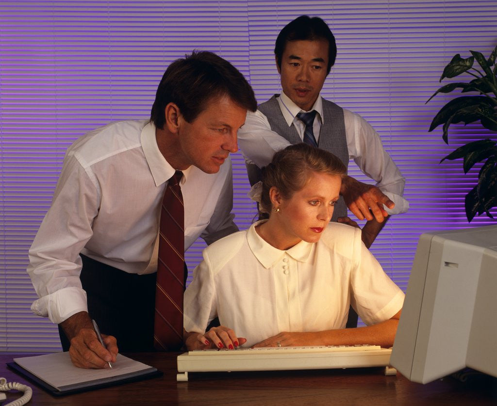 Detail of Business people working together at desktop computer by Anonymous
