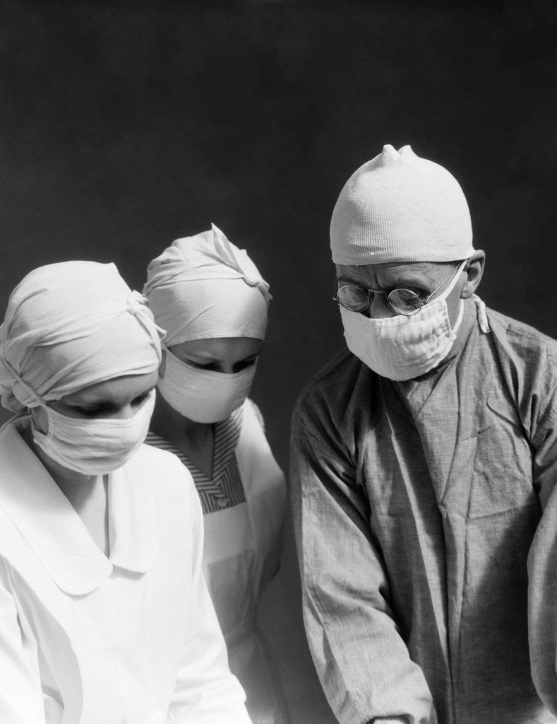 Detail of 1920s 1930s doctor and two nurses wearing surgical masks by Anonymous