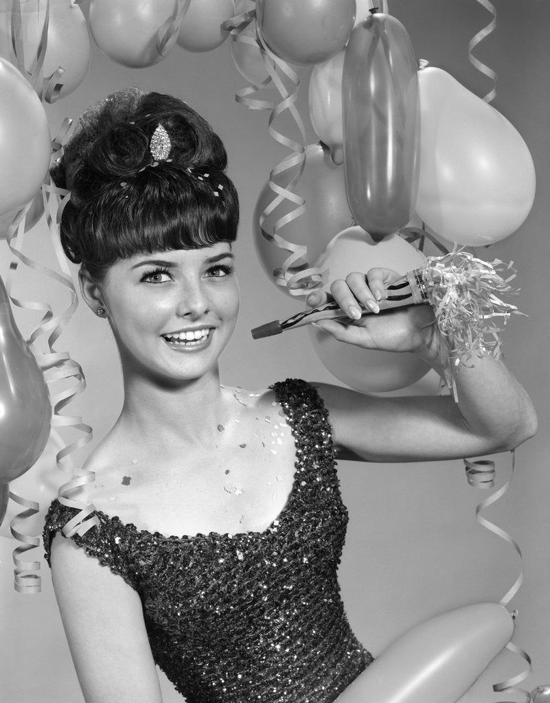 Detail of 1960s smiling young woman at New Year party by Anonymous