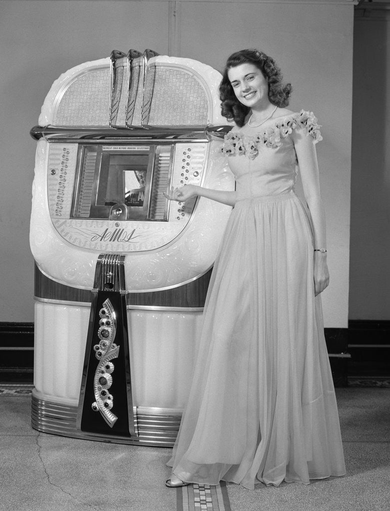 Detail of 1940s smiling woman with a jukebox by Corbis