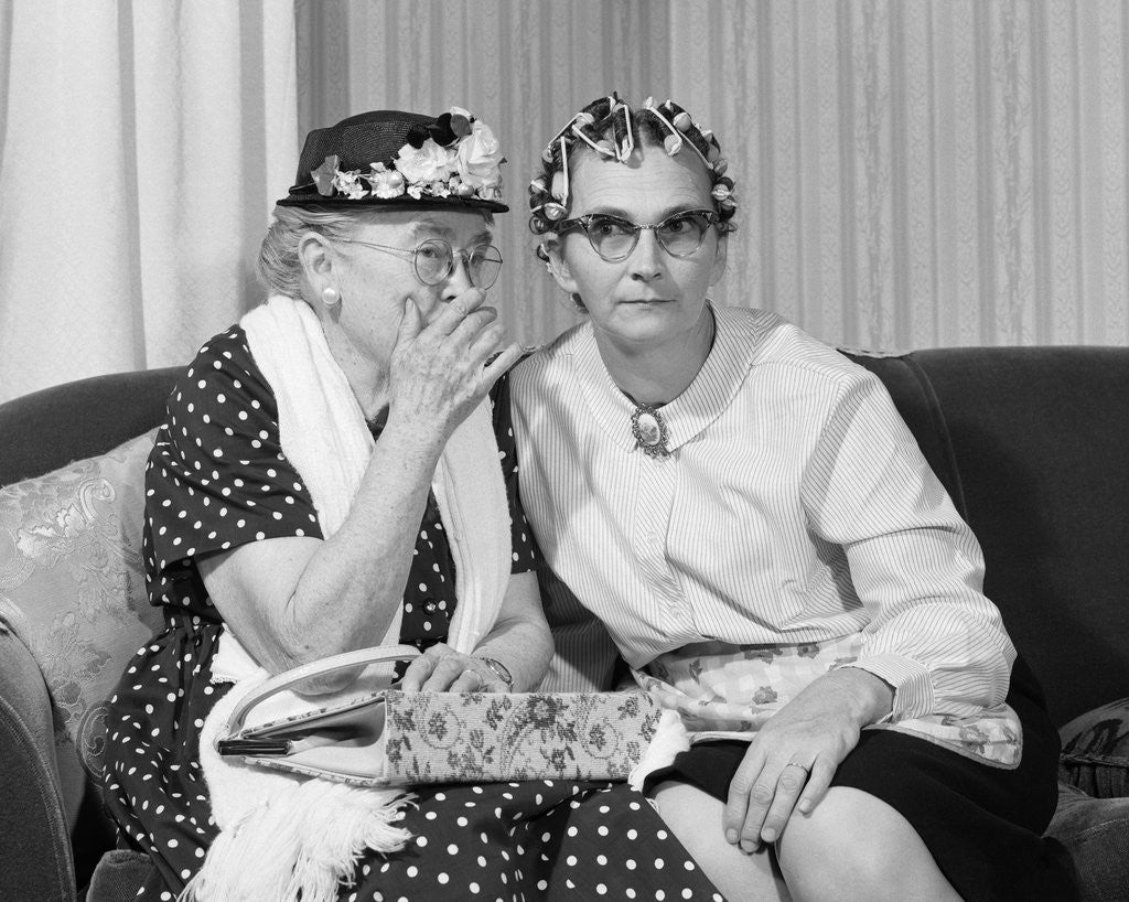 Detail of 1960s two senior women gossiping by Corbis