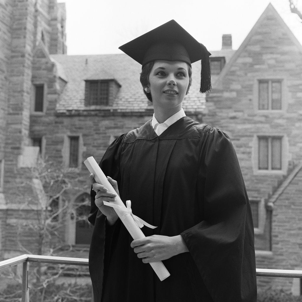 Detail of 1950s smiling female graduate holding a diploma by Anonymous