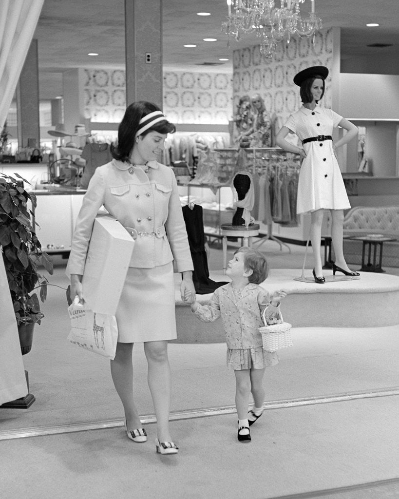 Detail of 1960s 1970s mother and daughter shopping in a department store by Anonymous