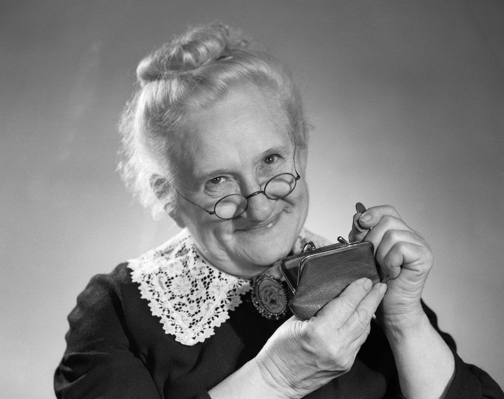 Detail of 1950s portrait of senior woman putting change into a purse by Anonymous