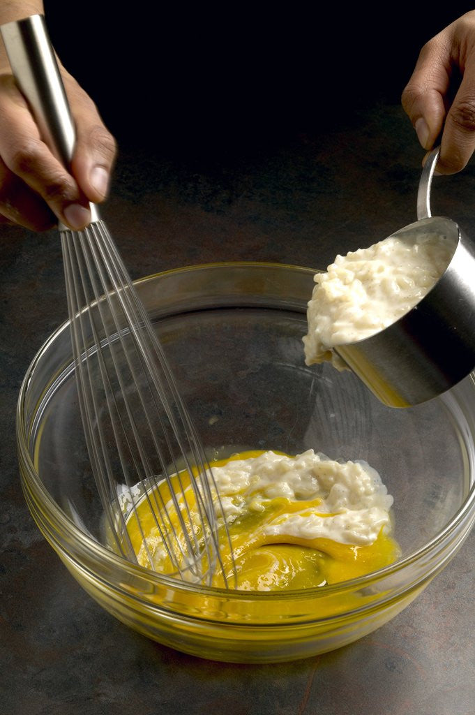 Detail of Adding hot rice to egg yolks by Corbis