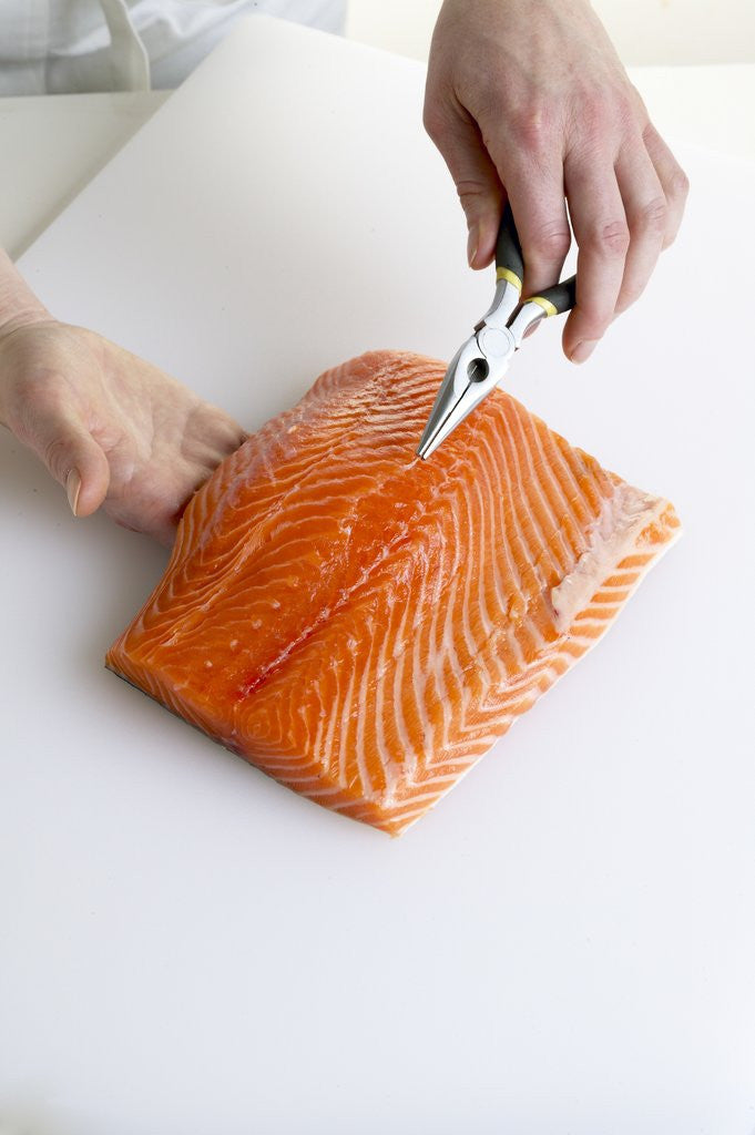 Detail of Deboning a salmon fillet by Anonymous