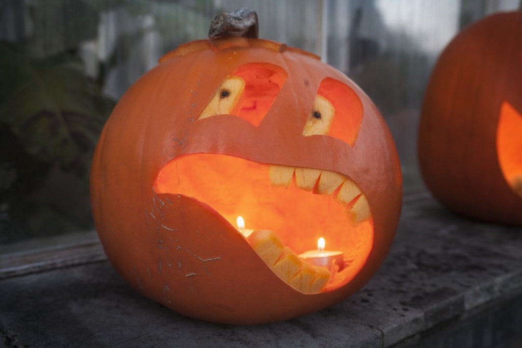 Detail of Funny pumpkin face lantern by Corbis
