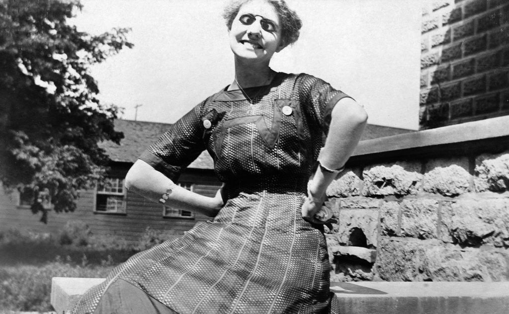 Detail of Young woman with goofy glasses, ca. 1912. by Anonymous