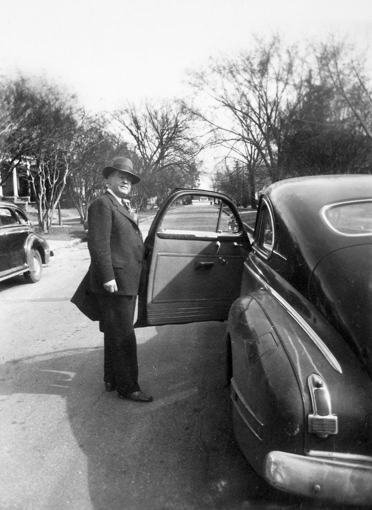 Detail of Mature man open his car door, ca. 1940. by Anonymous