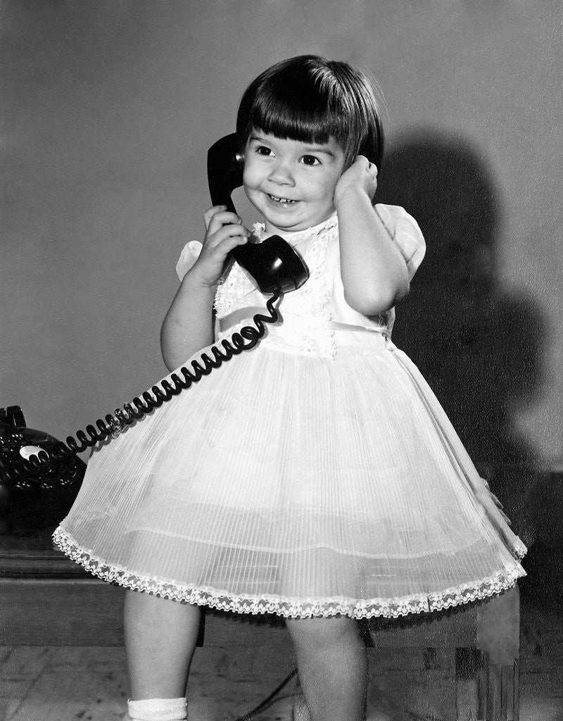 Detail of Young girl talks on the phone, ca. 1962. by Anonymous