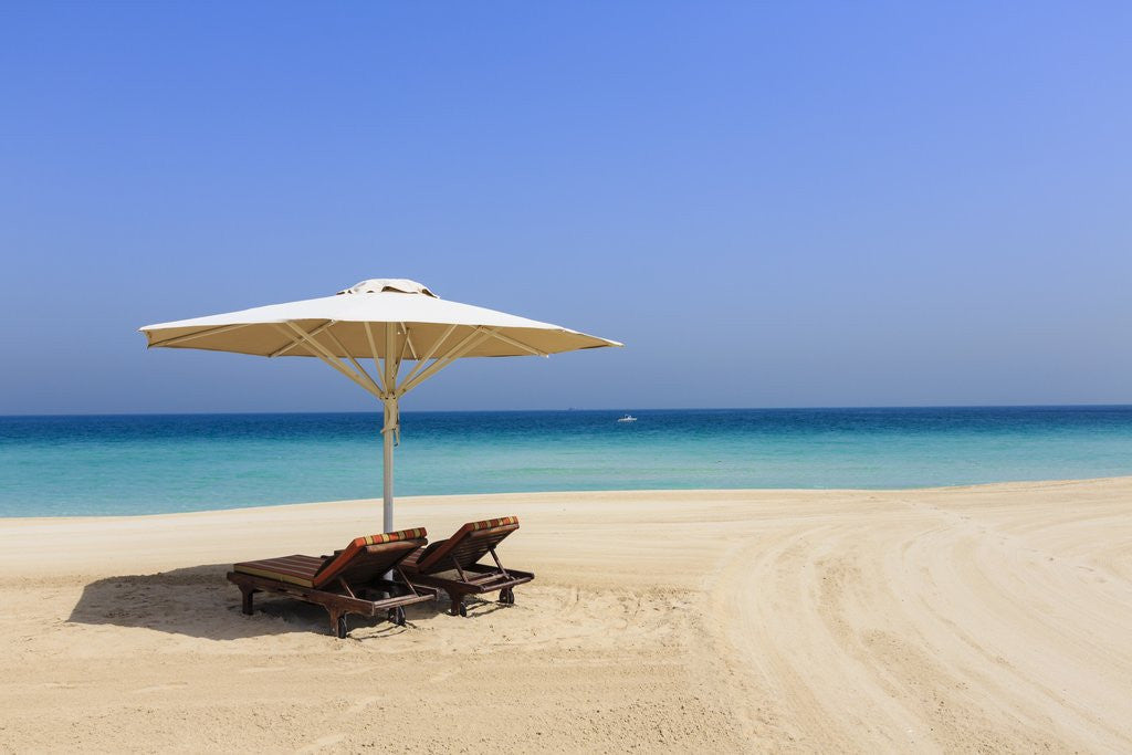 Detail of Parasol and recliner on the beach, Dubai by Anonymous