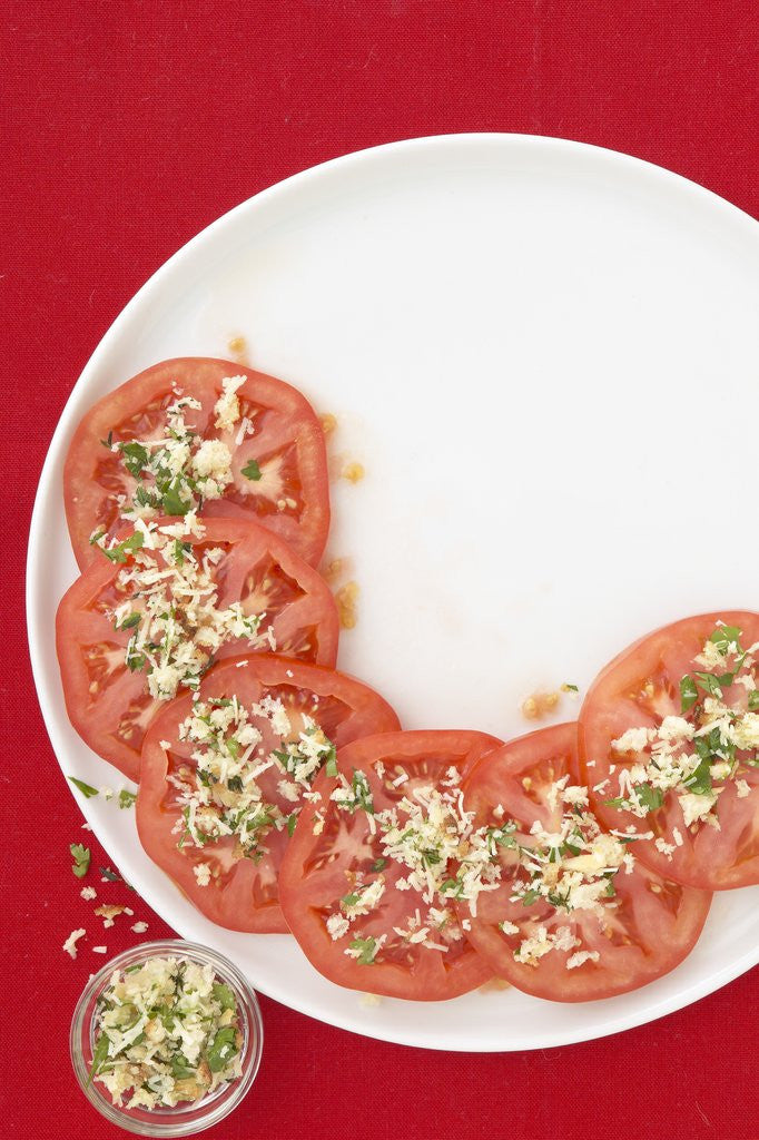 Detail of Tomato slices on a plate with topping by Anonymous